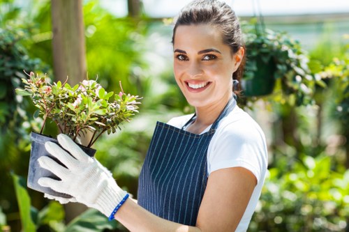 Gardener discussing insurance and safety at a job in Hammersmith